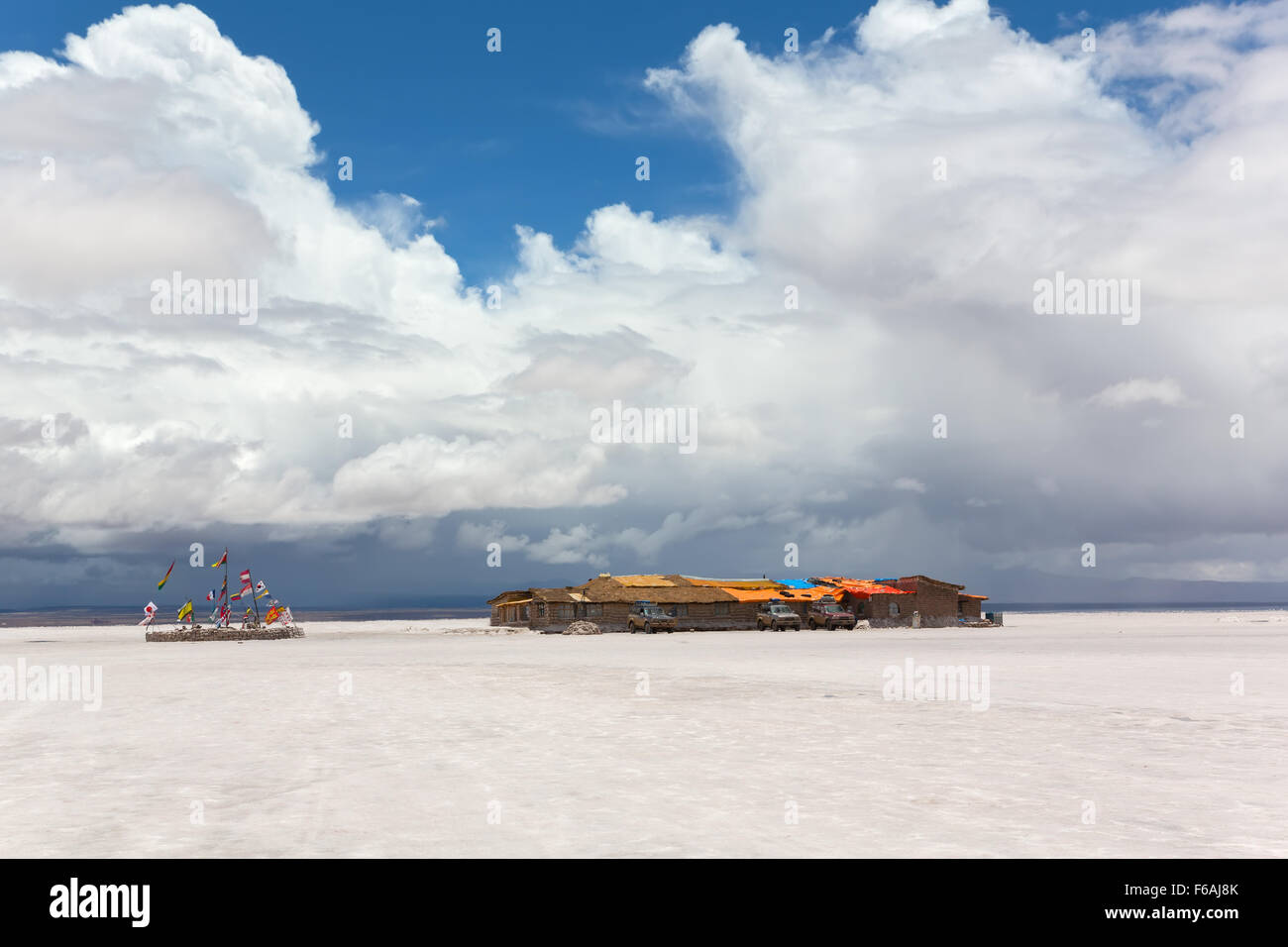 Salt hotel and flags of the states, Salar de Uyuni, Bolivia Stock Photo