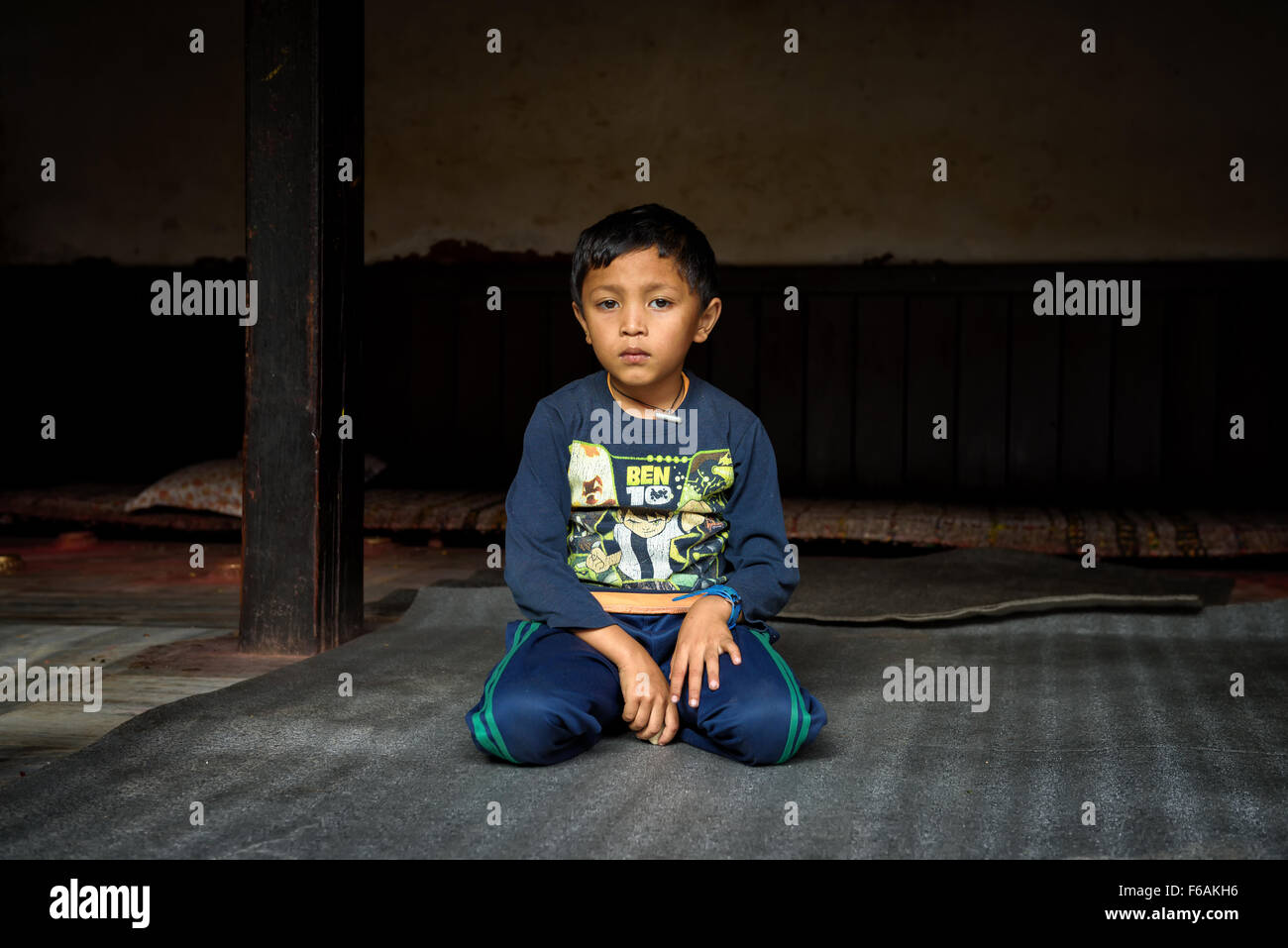 Young boy becomes a novice  at a buddhist temple in Kathmandu, Nepal Stock Photo
