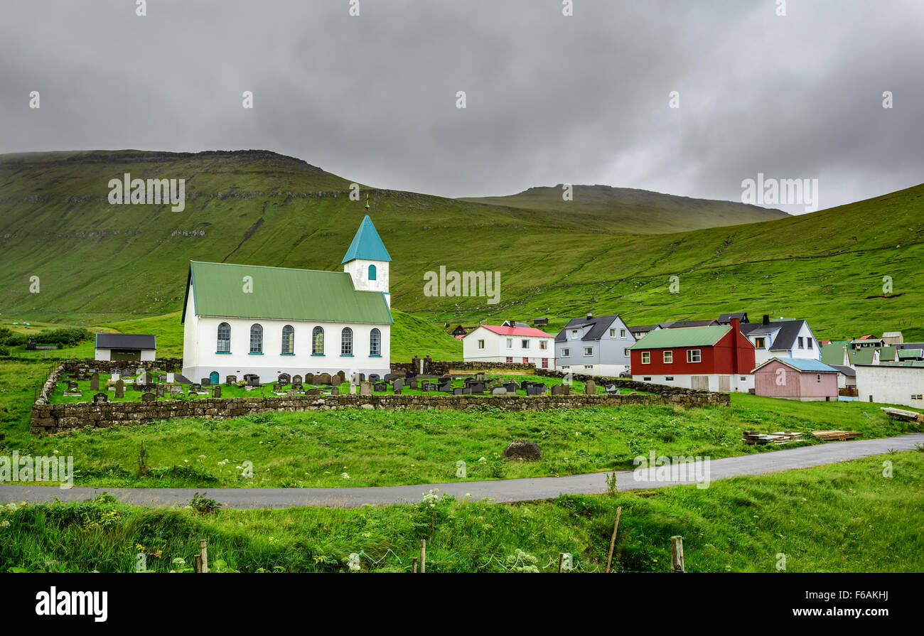 Small church with cemetery in the village of Gjogv located on the northeast tip of the island of Eysturoy, Faroe Islands, Denmar Stock Photo