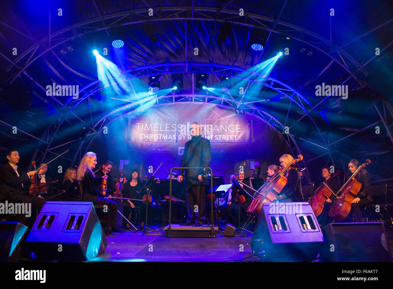 London, UK. 15 Novemebr 2015. The Philharmonia Orchestra conducted by Nicholas Dodd. Ballet superstar and Strictly Come Dancing judge Darcey Bussell switches on the 2015 Christmas Lights in Regent Street. The 2015 lights entitled Timeless Elegance are sponsored by Jo Malone. Credit:  Vibrant Pictures/Alamy Live News Stock Photo