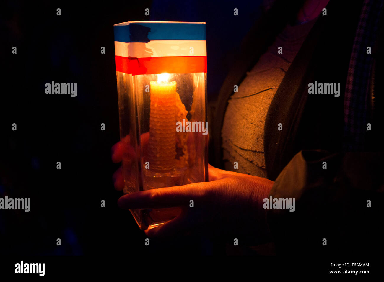 A vigil is held to Paris terrorist attack victims at the Senedd, Cardiff Bay, Wales. Stock Photo