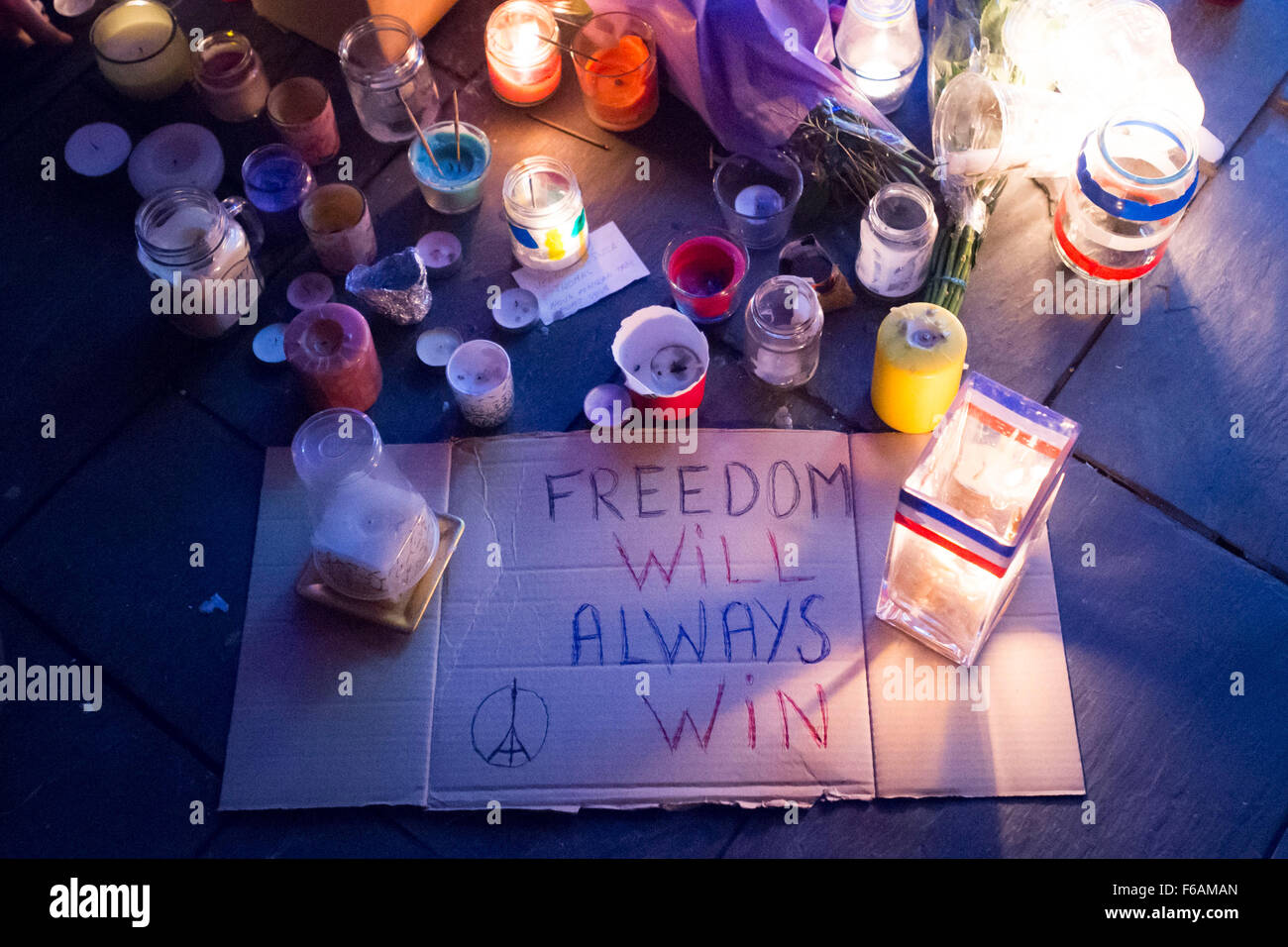A vigil is held to Paris terrorist attack victims at the Senedd, Cardiff Bay, Wales. Stock Photo