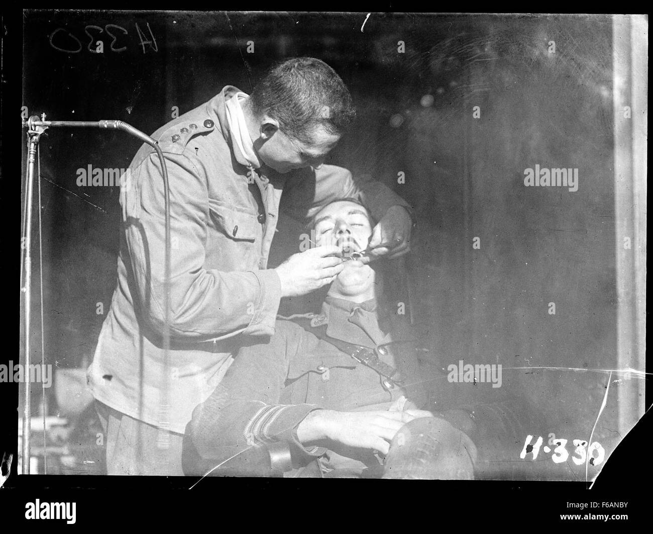 A New Zealand Dental Corps dentist carrying out an inspection Stock Photo Alamy