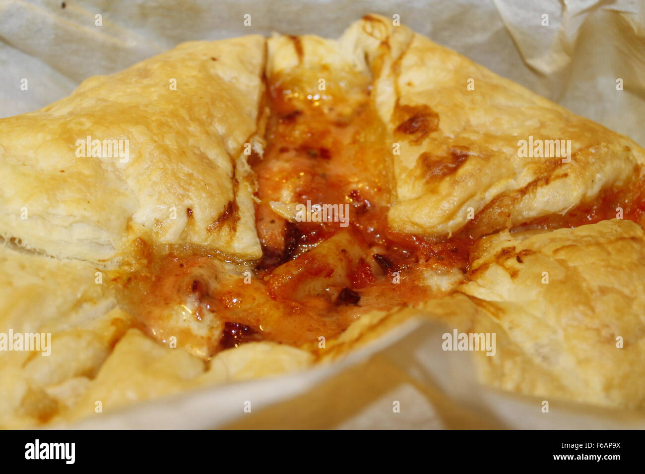 small savory pie with mozzarella cheese and tomato sauce Stock Photo