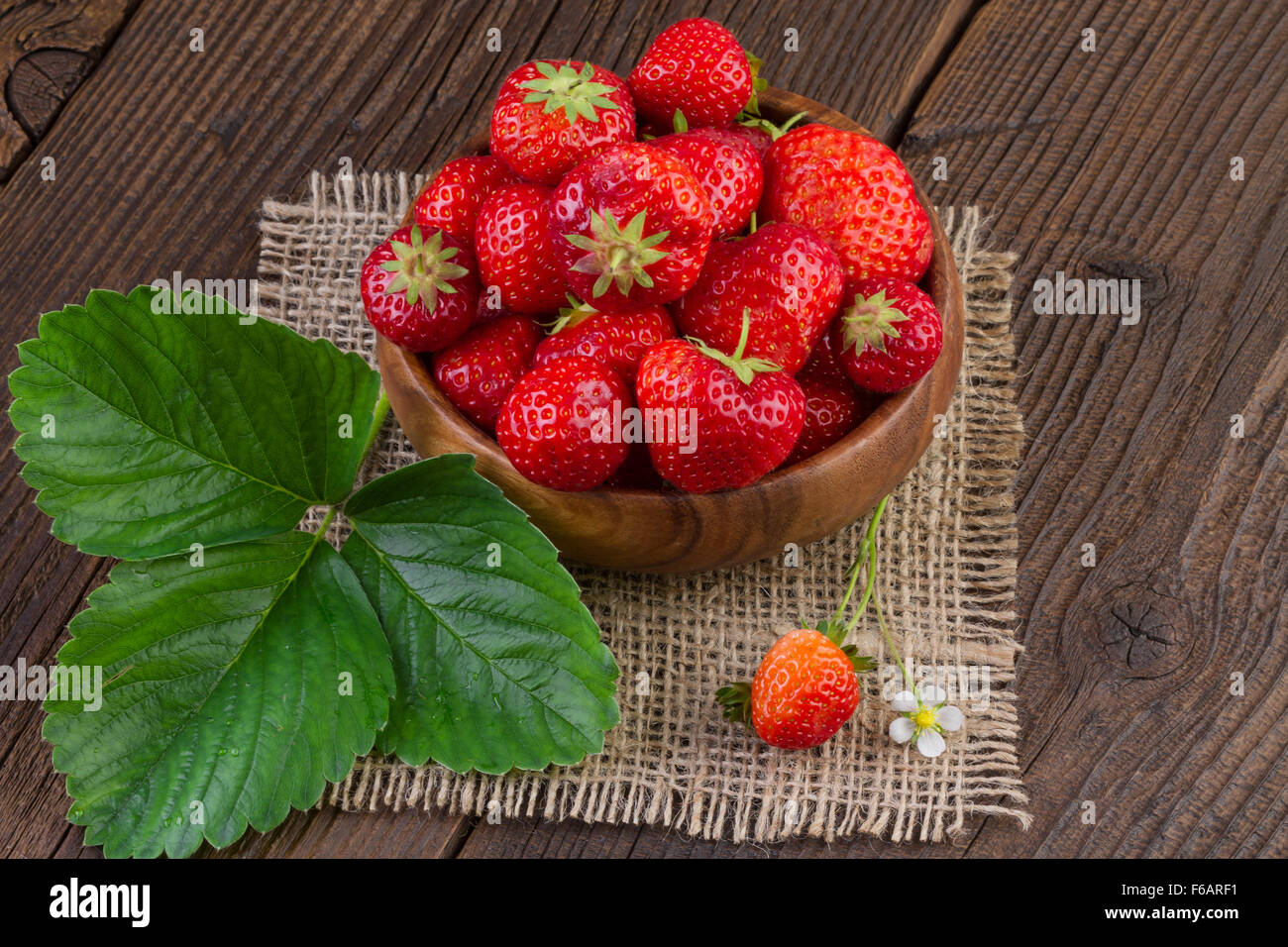 Strawberry in Wooden Bowl Stock Photo - Alamy