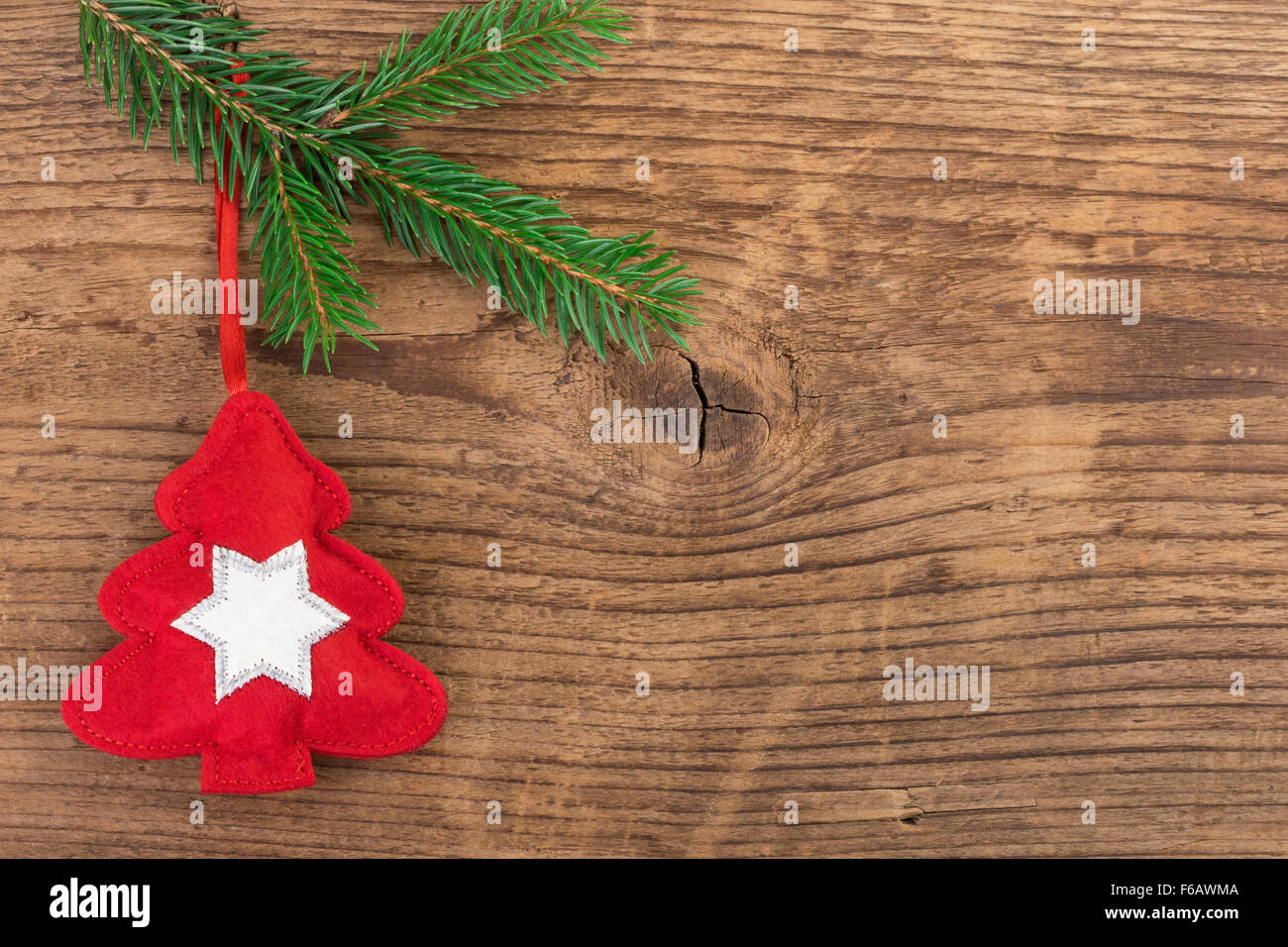 Christmas tree decoration with fir branch over wood Stock Photo