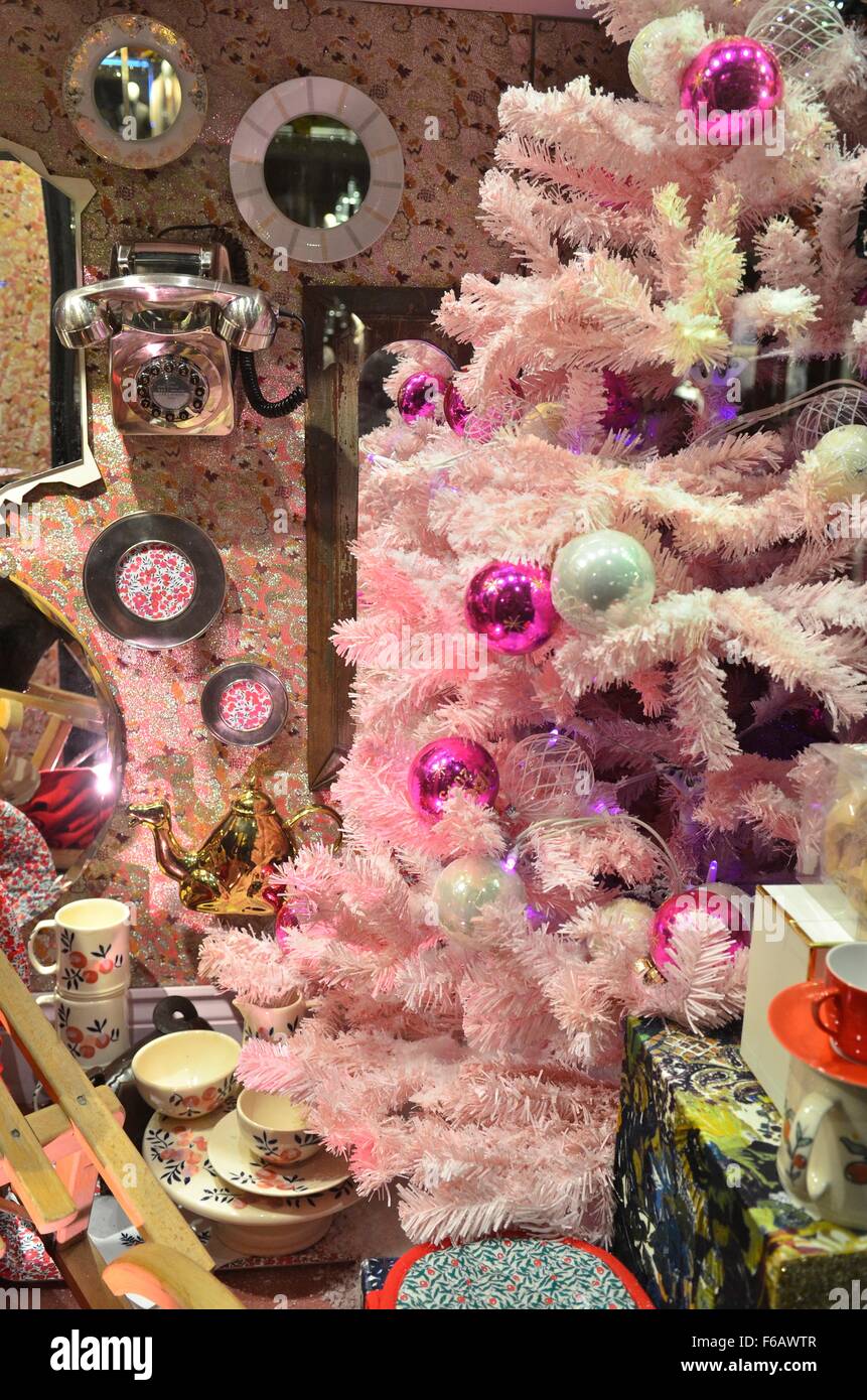 Pink Christmas tree and gifts in the window display at Liberty store
