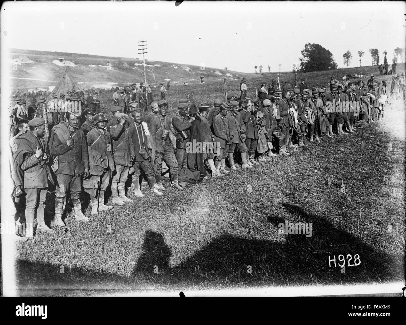 A photograph from World War I showing German prisoners of war in Puisieux, France. The image highlights the human cost of the conflict and the conditions prisoners faced during the war. Stock Photo