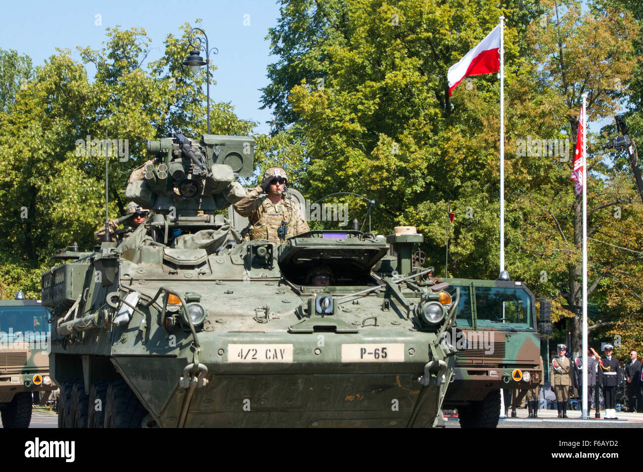 U.S. Soldiers with Papa Troop, 4th Squadron, 2nd Cavalry Regiment operate Stryker vehicles in the Polish Armed Forces Day Parade during Operation Atlantic Resolve, in Warsaw, Poland, Aug. 15, 2015. The U.S. and partner nations conducted land, sea and air exercises and maintained a rotational presence in order to reinforce NATO security commitments in Europe.   (U.S. Army photo by Spc. Marcus Floyd/Released) Stock Photo