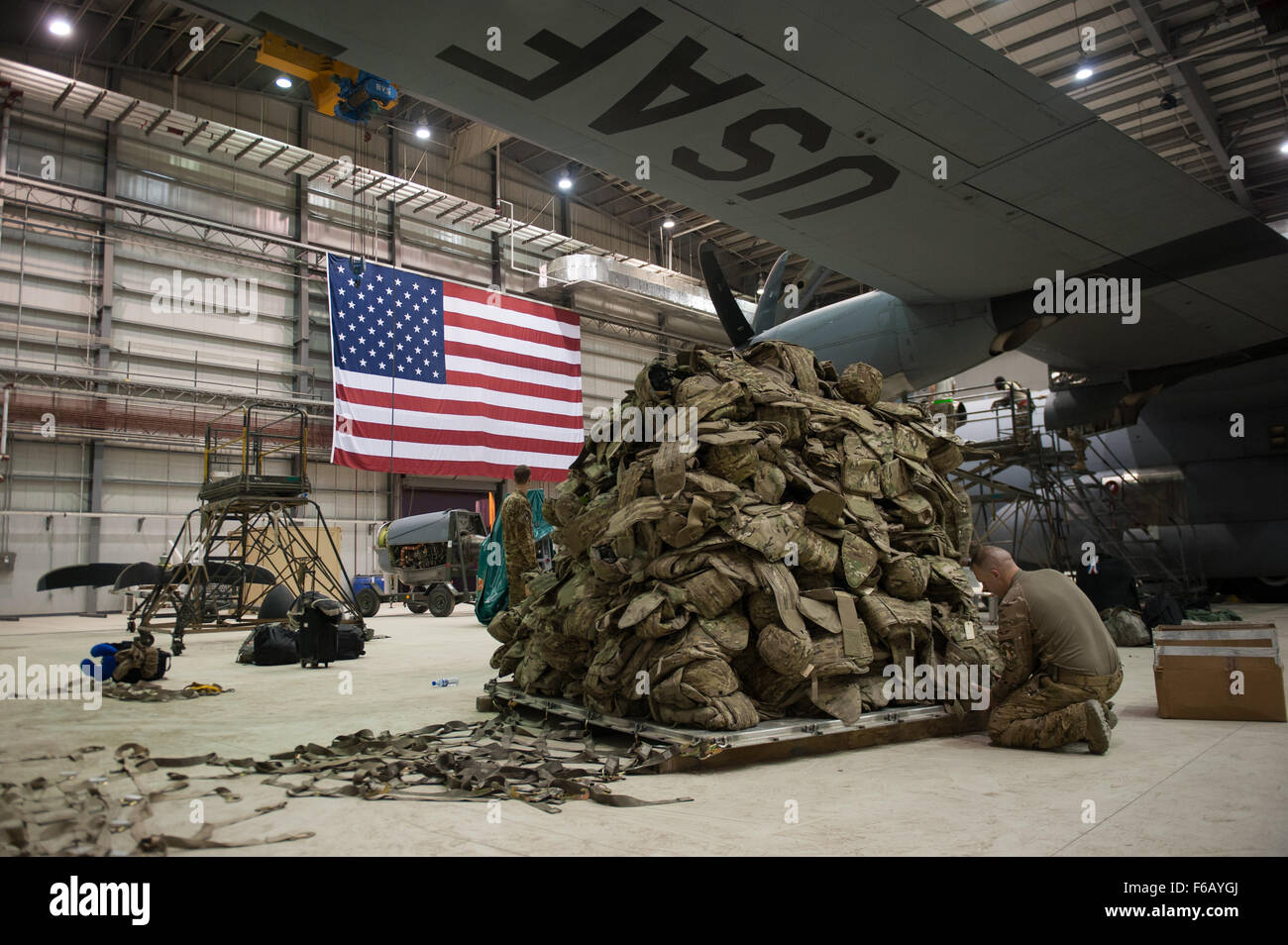 A U.S. Airman assigned to the 774th Expeditionary Airlift Squadron prepares a pallet before it is loaded onto a C-130J Super Hercules aircraft at Bagram Air Field, Afghanistan, Sept. 12, 2015. The Airman and the rest of his squadron were in the process of redeploying back to Little Rock Air Force Base after successfully completing their deployment. During their rotation as the 774th Expeditionary Airlift Squadron, the Little Rock team completed 1,850 combat sorties and moved 14,500 passengers and 17 million pounds of cargo.  (U.S. Air Force photo by Tech. Sgt. Joseph Swafford/Released) Stock Photo