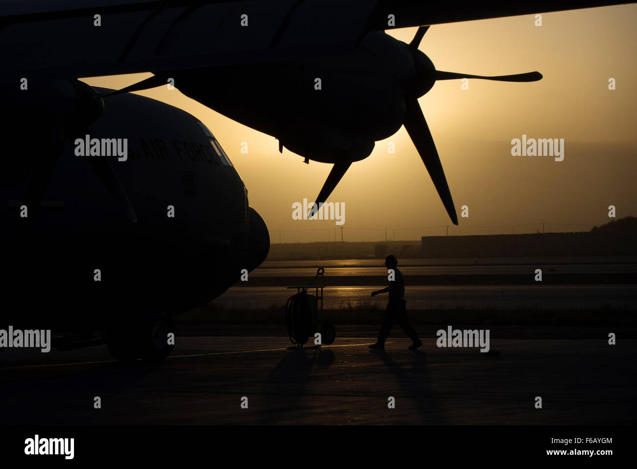 A U.S. Airman assigned to the 774th Expeditionary Airlift Squadron completes a preflight inspection on a C-130J Super Hercules aircraft at Bagram Air Field, Afghanistan, Sept. 12, 2015. The Airman and the rest of his squadron were in the process of redeploying back to Little Rock Air Force Base after successfully completing their deployment. During their rotation as the 774th Expeditionary Airlift Squadron, the Little Rock team completed 1,850 combat sorties and moved 14,500 passengers and 17 million pounds of cargo.  (U.S. Air Force photo by Tech. Sgt. Joseph Swafford/Released) Stock Photo