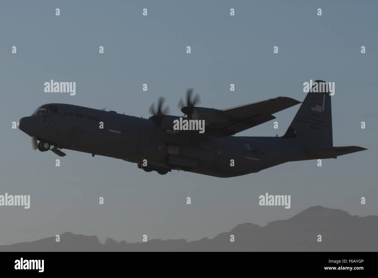 A U.S. Air Force C-130J Super Hercules aircraft assigned to the 774th Expeditionary Airlift Squadron takes off from Bagram Air Field, Afghanistan, Sept. 12, 2015. The aircraft and the rest of the squadron were in the process of redeploying back to Little Rock Air Force Base after successfully completing their deployment. During their rotation as the 774th Expeditionary Airlift Squadron, the Little Rock team completed 1,850 combat sorties and moved 14,500 passengers and 17 million pounds of cargo.  (U.S. Air Force photo by Tech. Sgt. Joseph Swafford/Released) Stock Photo
