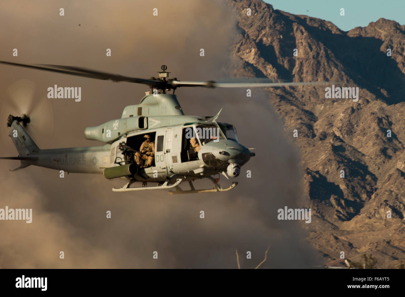 A UH-1Y Venom assigned to Marine Aviation Weapons and Tactics Squadron One (MAWTS-1), lifts off of an expeditionary airfield during an air ground defense exercise at Landing Zone Bull at Chocolate Mountain Aerial Gunnery Range, Calif., Oct. 10, 2015. This training evolution is apart of WTI 1-16, a seven week training event, hosted by Marine Aviation Weapons and Tactics Squadron One (MAWTS-1) cadre, which emphasizes operational integration of the six functions of Marine Corps aviation in support of a Marine Air Ground Task Force. MAWTS-1 provides standardized advanced tactical training and cert Stock Photo