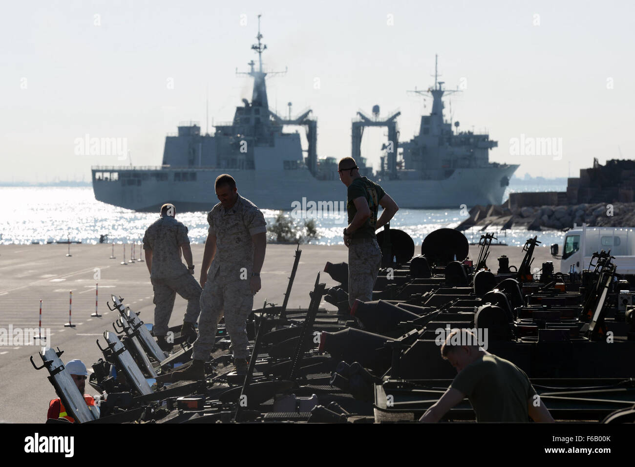 U.S. Marines inspect vehicles on the pier aside the USNS Sgt. William R. Button during a Maritime Prepositioning Force (MPF) as they prepare for NATO-led Exercise Trident Juncture 2015. More than 30 nations and 36,000 service members are participating in the event, Rota, Spain, Oct. 21, 2015. (U.S. Army photo by Visual Information Specialist Jason Johnston/Released) Stock Photo