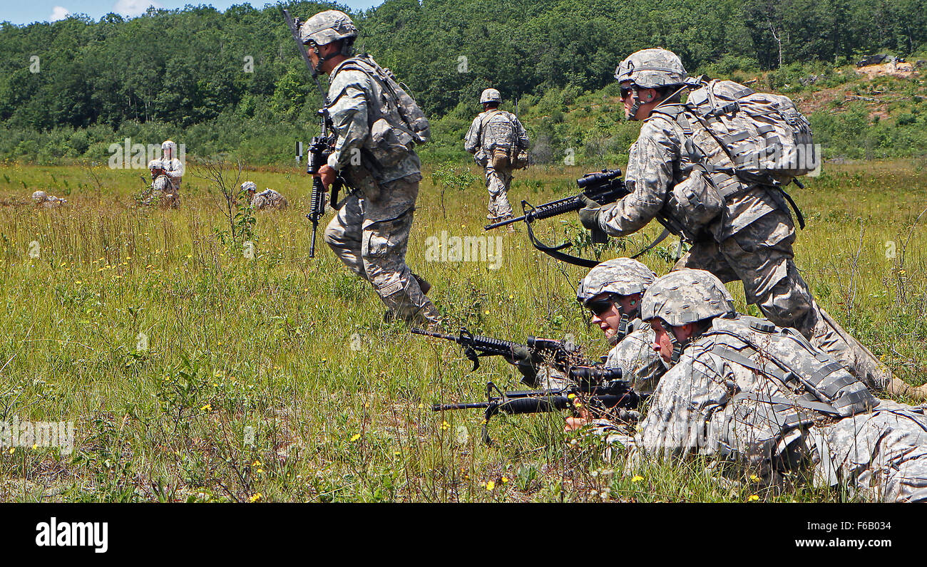 Soldiers assigned to C-Troop, 1st Battalion, 126th Cavalry Regiment bound across an objective during a combined live-fire exercise at the air-to-ground gunnery range on Camp Grayling Joint Maneuver Training Center during a joint live-fire exercise as part of  Northern Strike 2015, July 21, 2015. ONS is mass training exercise hosted annually on CGJMTC and evaluates joint air-to-ground capability and combat readiness. (U.S. Army photo by Sgt. Seth LaCount, 126th Press Camp, Michigan Army National Guard) Stock Photo