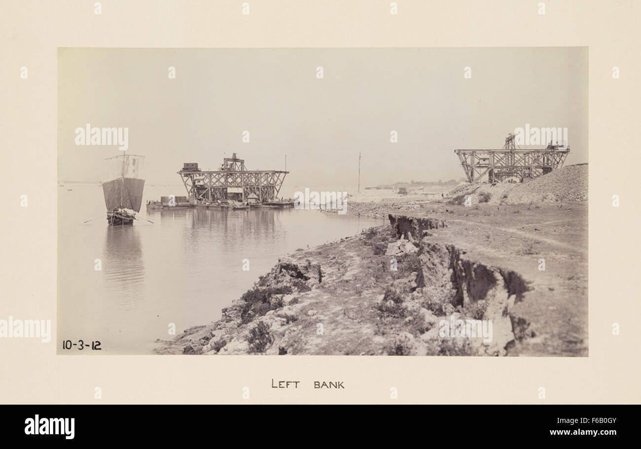 This image captures the construction of a railroad bridge on the Left ...