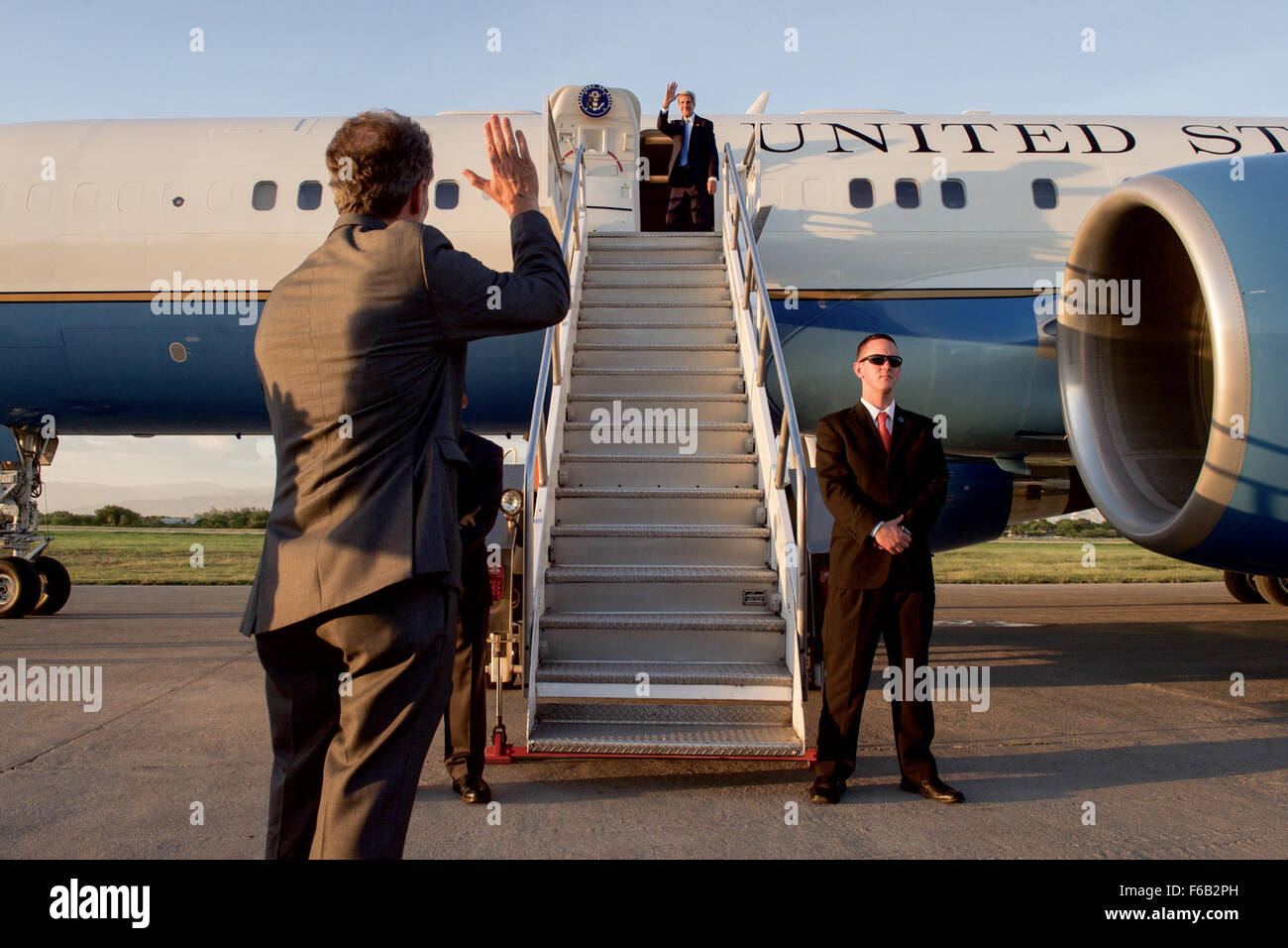 Ambassador Mulrean Waves Goodbye to Secretary Kerry at Port-Au-Prince International Airport Stock Photo