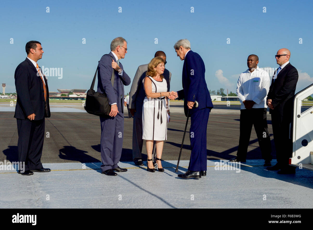 Secretary Kerry is Greeted by Cuban Ministry of Foreign Affairs Deputy Chief of Protocol Gonzales Upon His Arrival in Havana Stock Photo