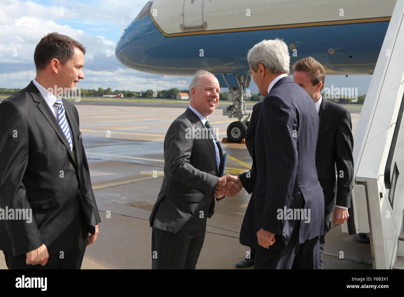 Secretary Kerry is Greeted by the Head Ofgerman Protocol and Embassy Charge d'affaires Upon Arrival in Berlin, Germany Stock Photo