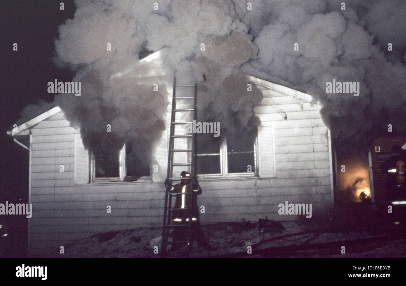 Lanham, Maryland, 1980  Arson fire in home for sale. Fire flashes over and forms a fire devil. Credit: Mark Reinstein Stock Photo