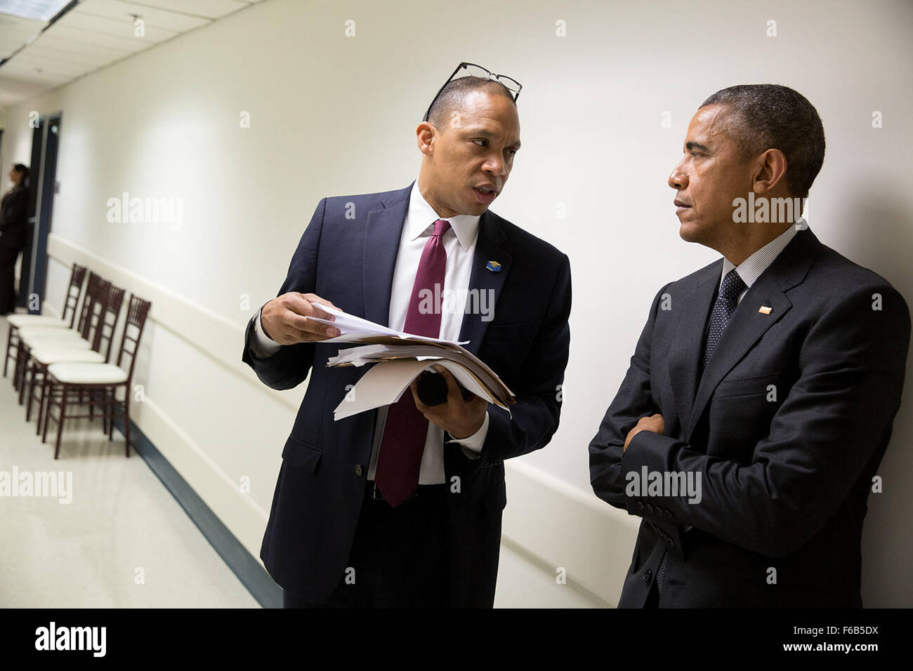 President Barack Obama speaks with Rob Nabors, Senior Advisor to the Veterans Affairs Secretary, prior to a briefing on the progress made to improve the Department of Veterans Affairs' ability to serve veterans in a timely and effective manner, at the Phoenix VA Medical Center in Phoenix, Ariz., March 13, 2015. Stock Photo