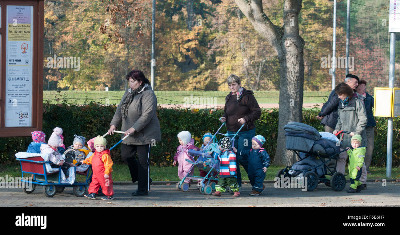 Child-minders and infants taking a walk in Colditz, Germany Stock Photo