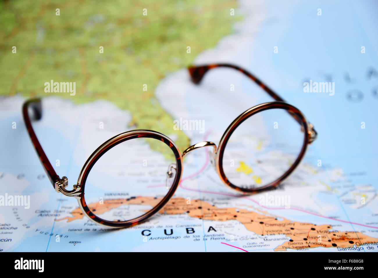 Glasses on a map - Cuba Stock Photo