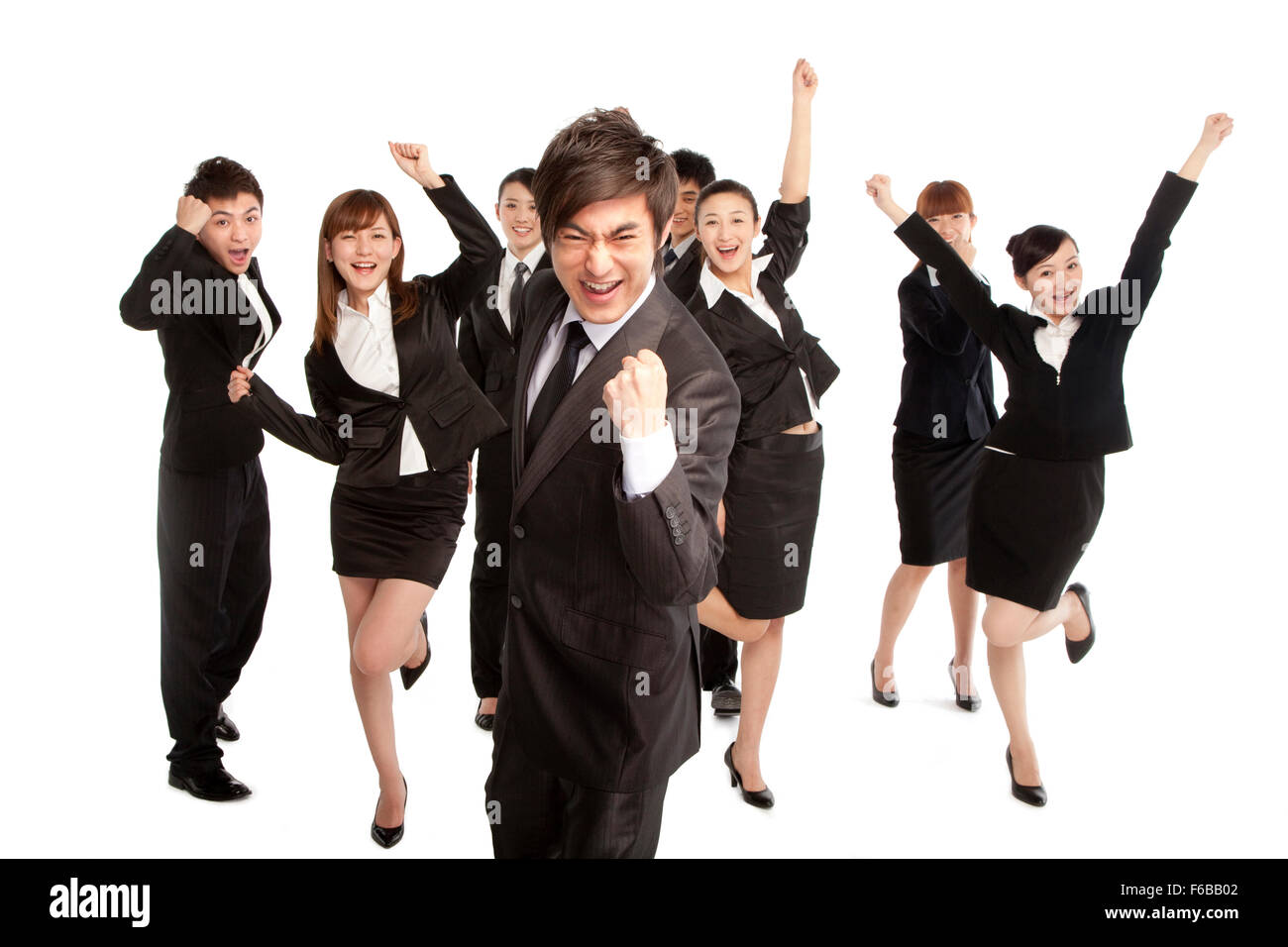 A group of business people holding umbrella Stock Photo