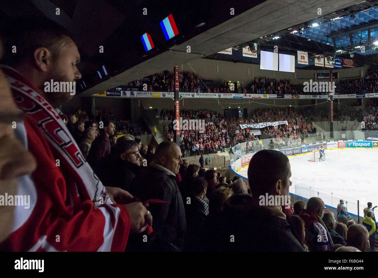 French flags light under a roof as players of ice hockey teams PSG Zlin, let, and HC Dynamo Pardubice and fans observe a minute of silence in honor the victims of the Nov. 13 deadly attacks in Paris before the Czech Extraliga match in Pardubice, Czech Republic, Sunday, Nov. 15, 2015. (CTK Photo/David Tanecek) Stock Photo