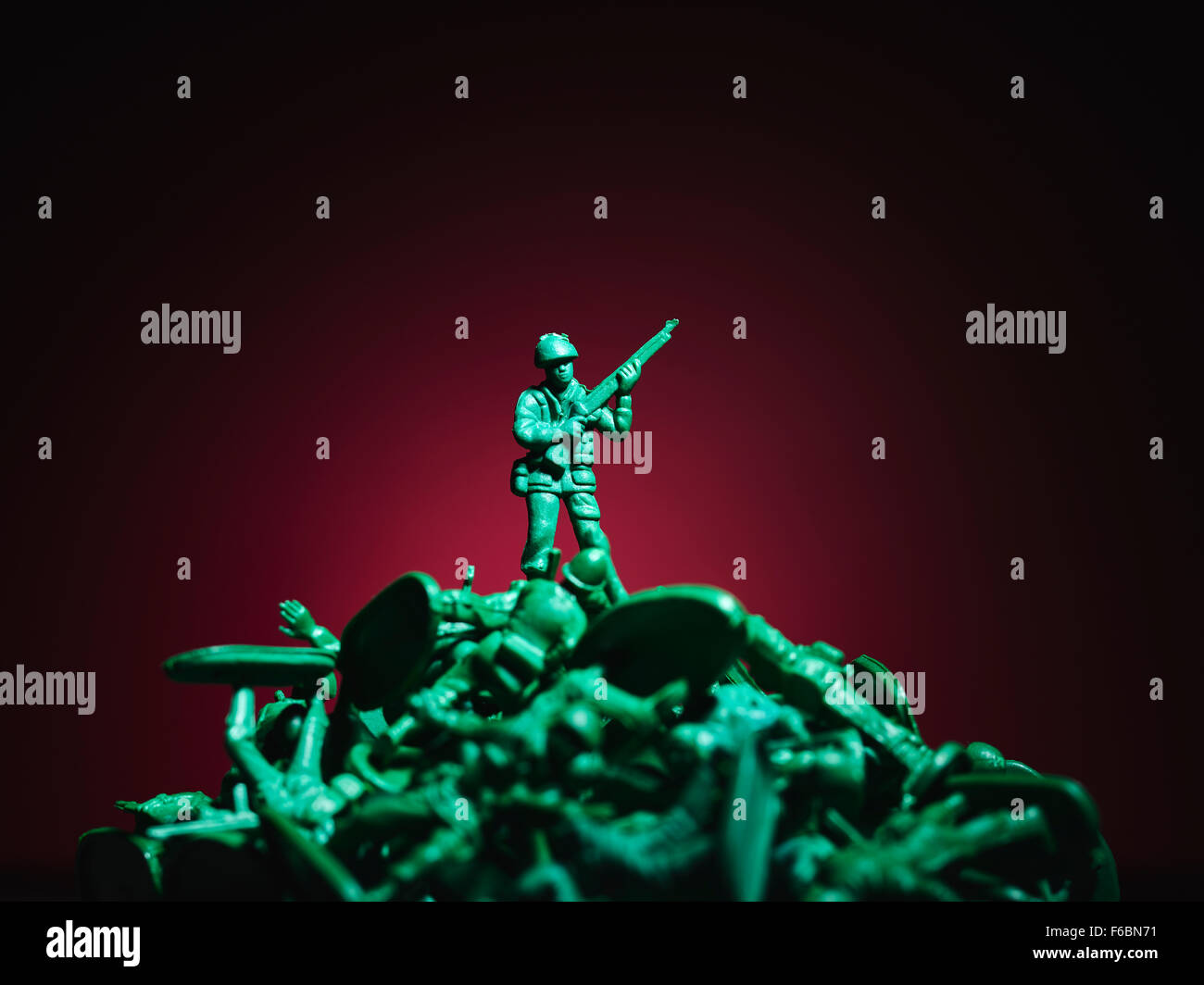 Plastic soldier and pile of soldiers Stock Photo