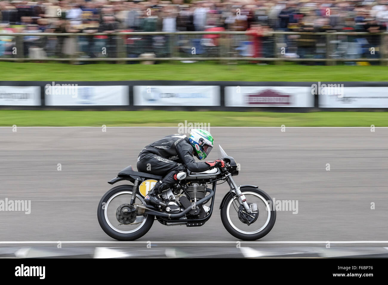 Classic motorcycles racing at the Goodwood Revival on 13/09/2015 at Goodwood MotorCircuit, Chichester.  Bikes negotiate the chicane and enter the main straight. Picture by Julie Edwards/Photoshot Stock Photo
