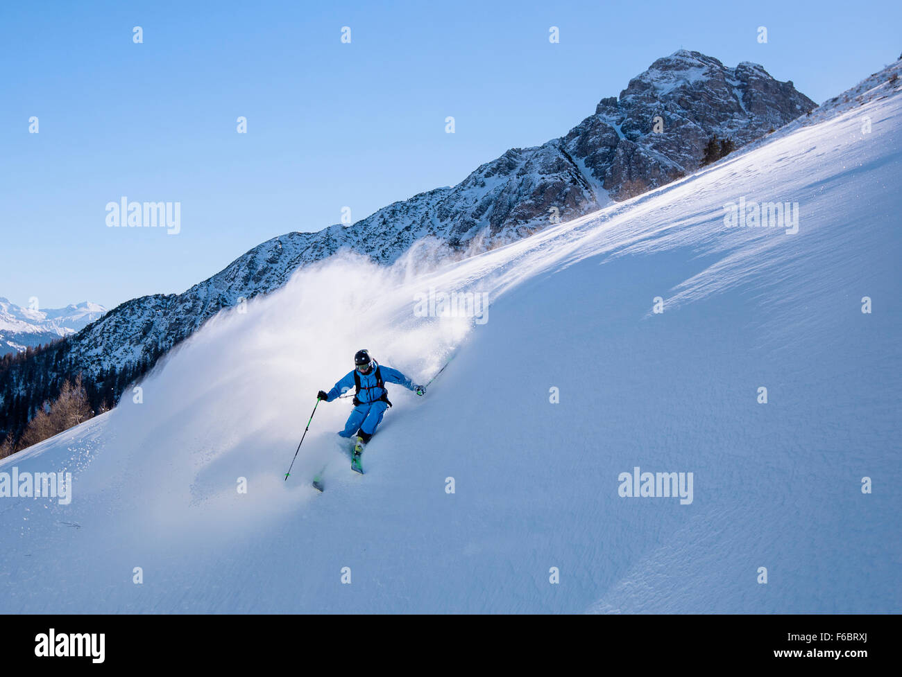 Freerider off-piste in deep snow, Muttereralmpark, Spitzmandl (2206m) behind, North Tyrol, Austria Stock Photo