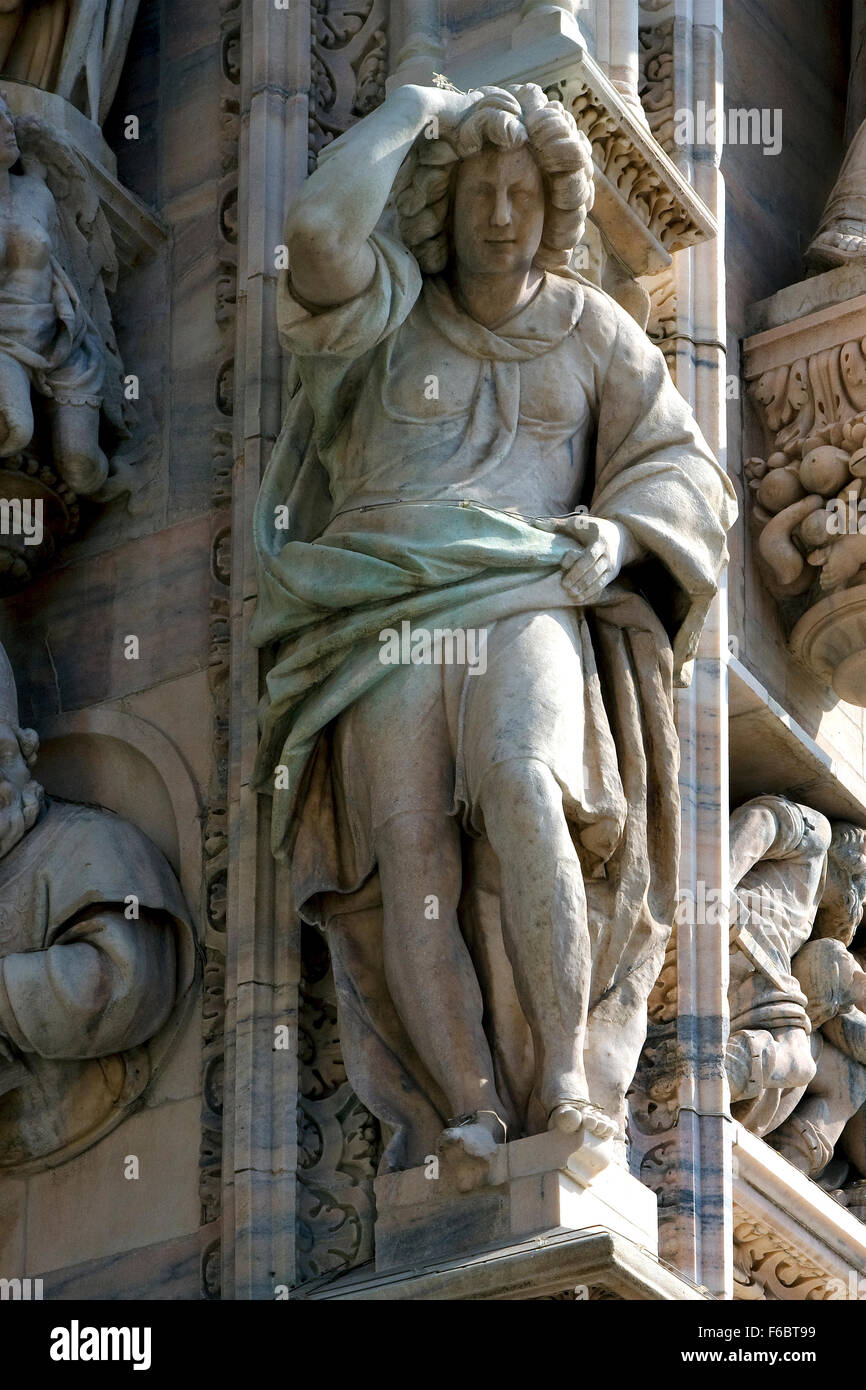 italy statue of a women in the front of the duomo church in milan and ...