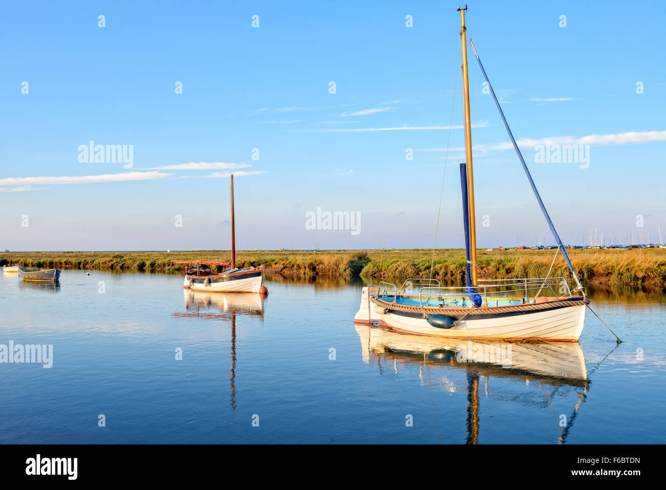 Boats on the creek at Blakeney on the north coast of Norfolk Stock Photo