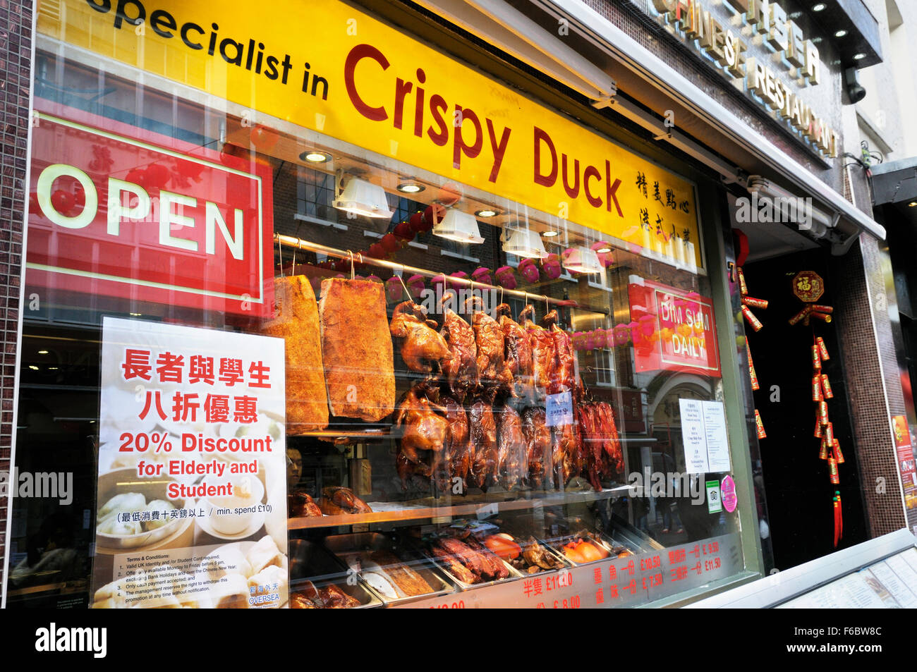 Crispy duck hanging in the window of a Chinese restaurant, Gerrard Streeet, Chinatown, Soho, London, UK Stock Photo