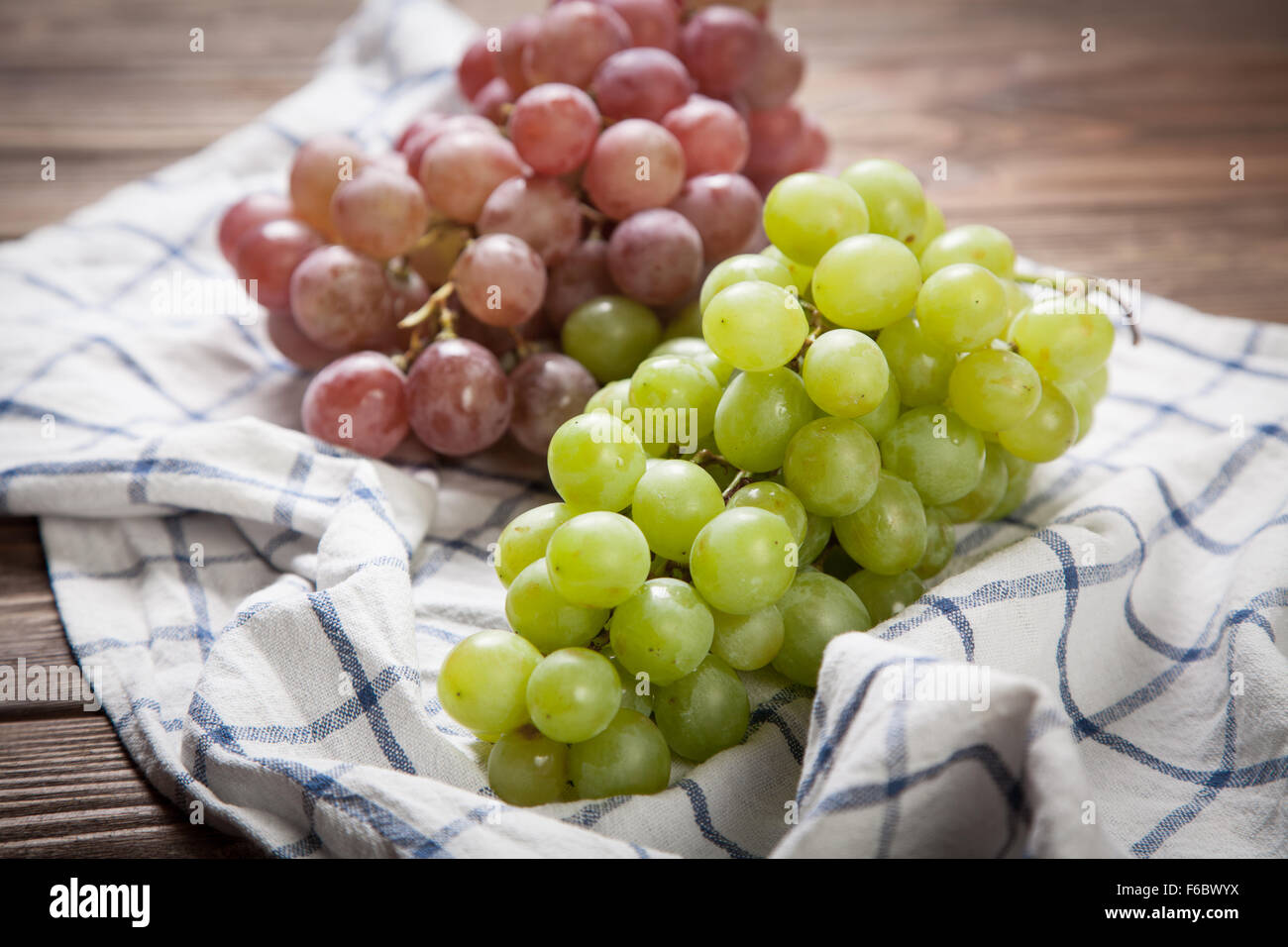 Delicious grapes on a kitchen table Stock Photo - Alamy