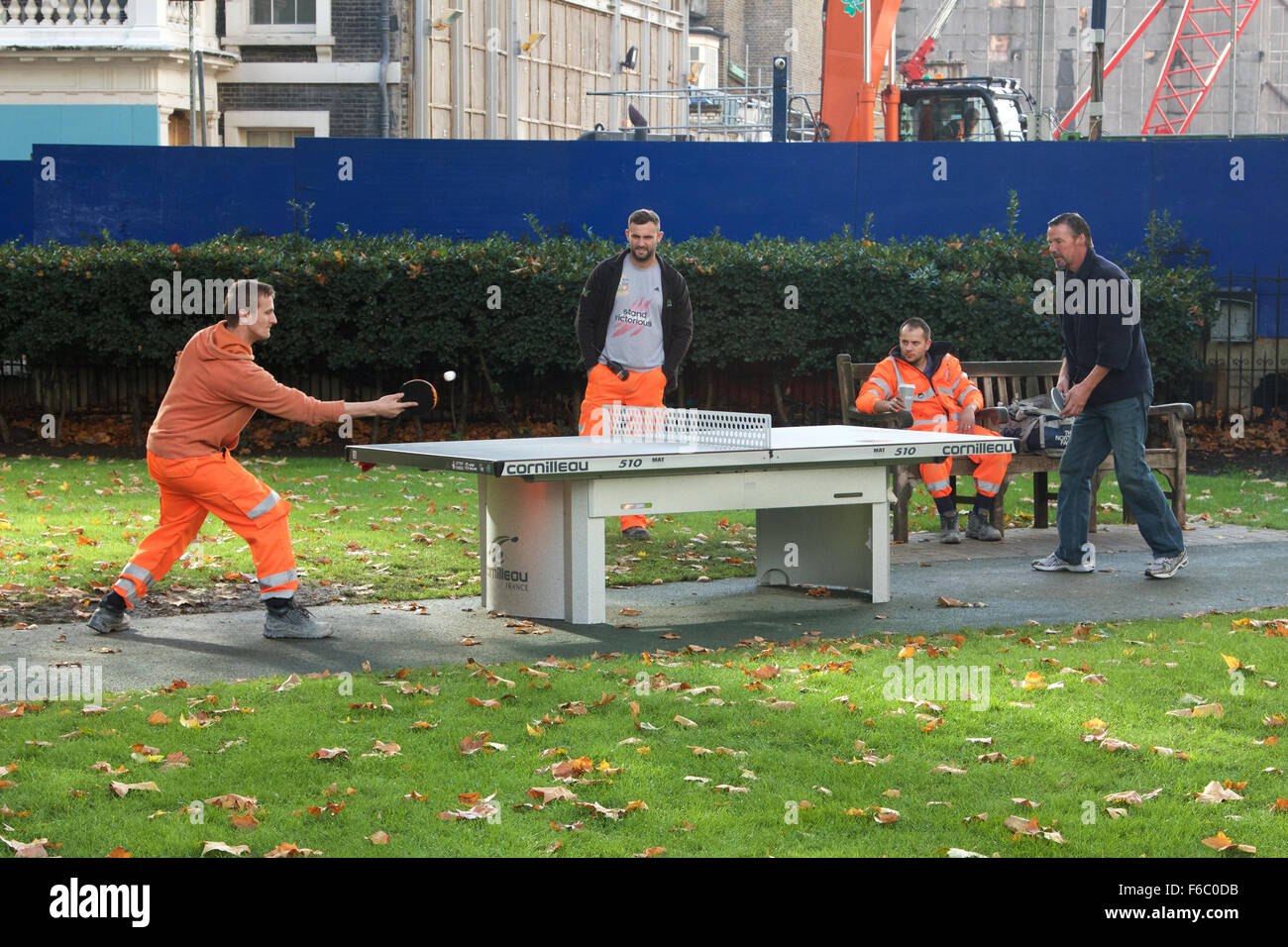 Workmen in Hanover Square, London, playing table tennis Stock Photo