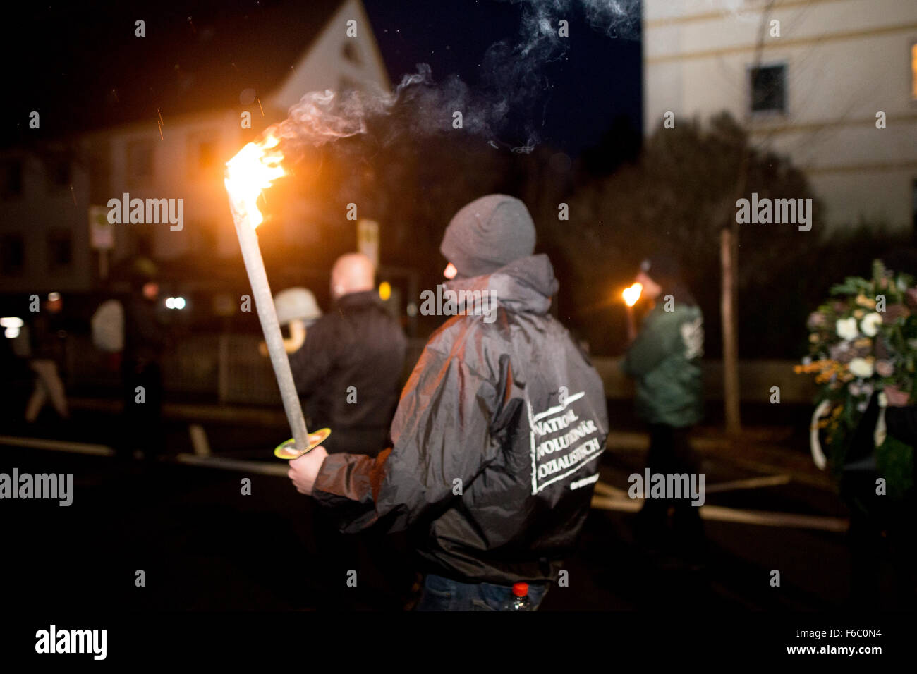 Neonazi carrying torch in the rain. (Photo by Michael Trammer / Pacific Press) Stock Photo