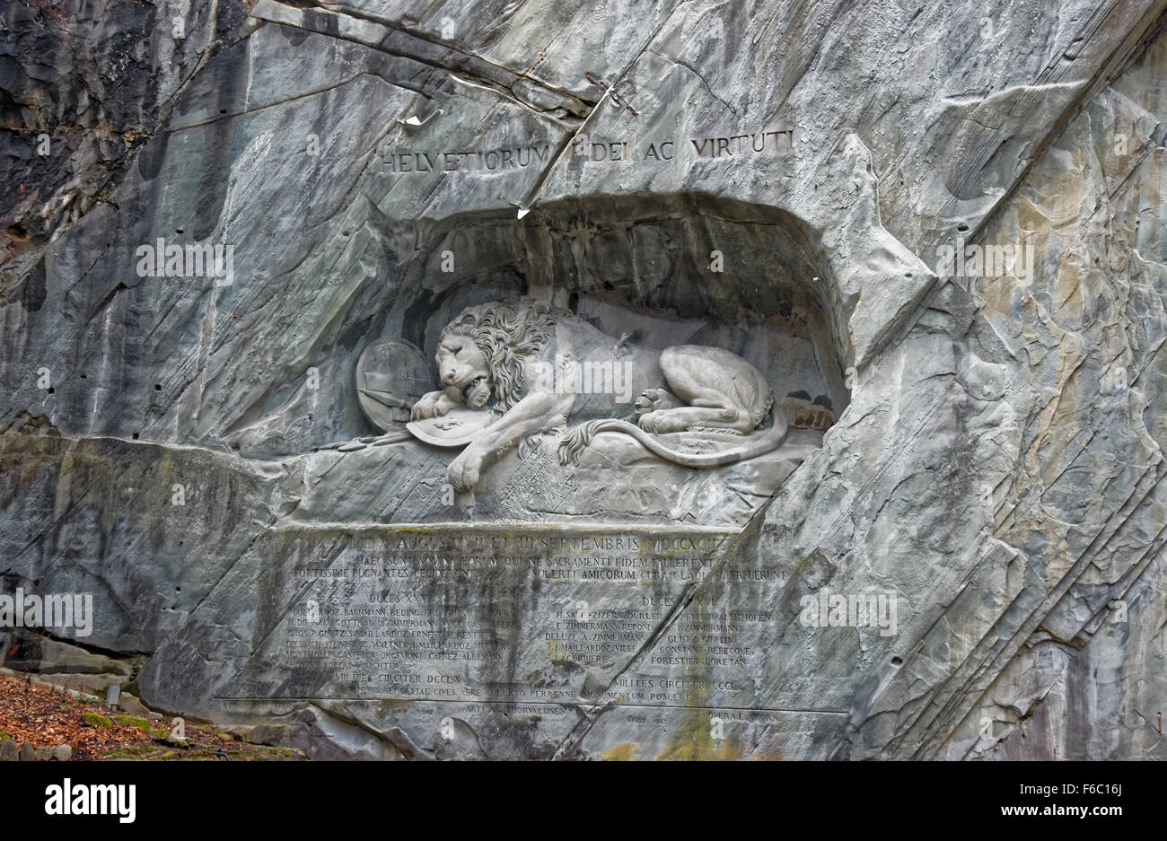 Dying Lion monument, a sculpture in Lucerne (Switzerland) carved in the rock to honor Swiss Guards who were massacred during the French Revolution when revolutionaries stormed the Tuileries Palace Stock Photo