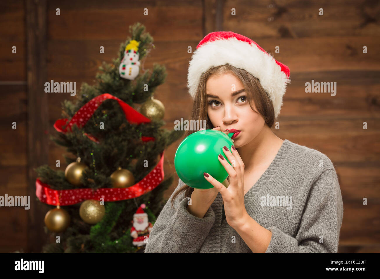 Beautiful girl blowing a baloon Stock Photo