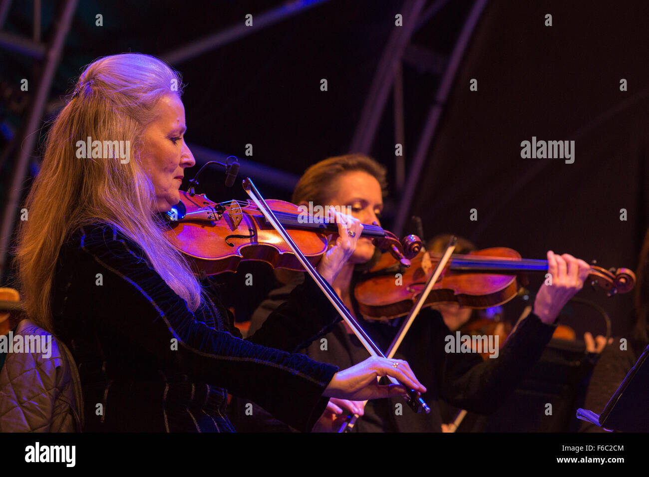 Violinists from the Philharmonia Orchestra at rehearsals for the switch-on of Christmas lights in Regent Street, London, UK Stock Photo