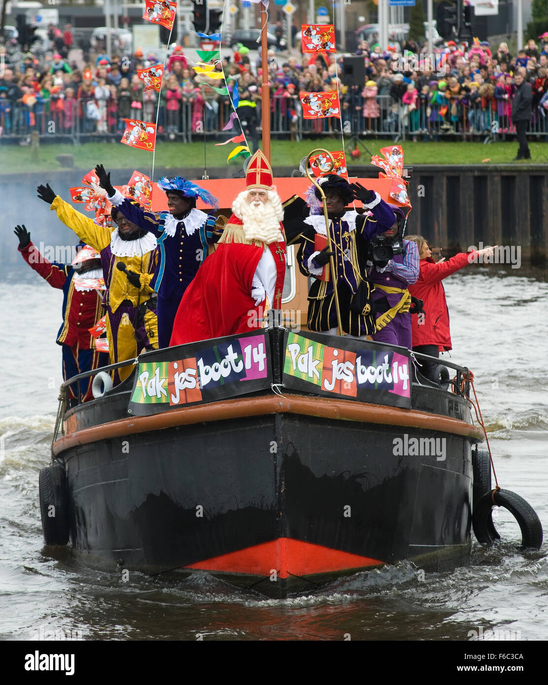 The dutch Santa Claus called 'Sinterklaas' is greeting the children after  he has arrival in the harbor by boat from spain Stock Photo - Alamy