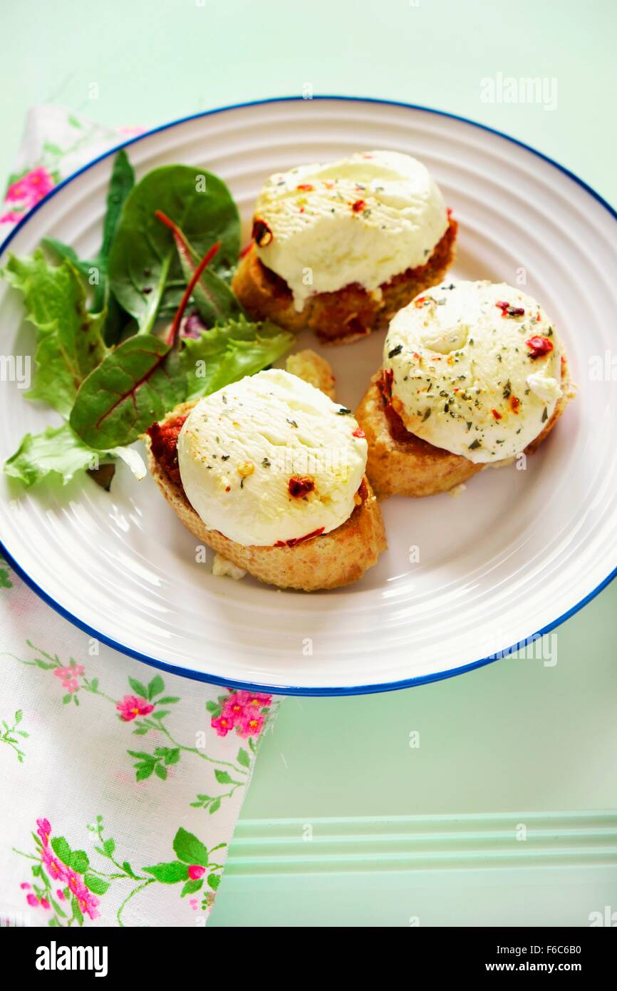 Baked goat's cheese crostini Stock Photo Alamy