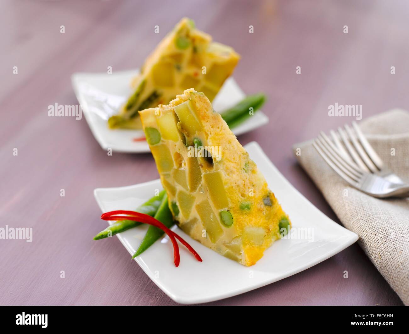 Spanish tortilla with peas and herbs Stock Photo Alamy