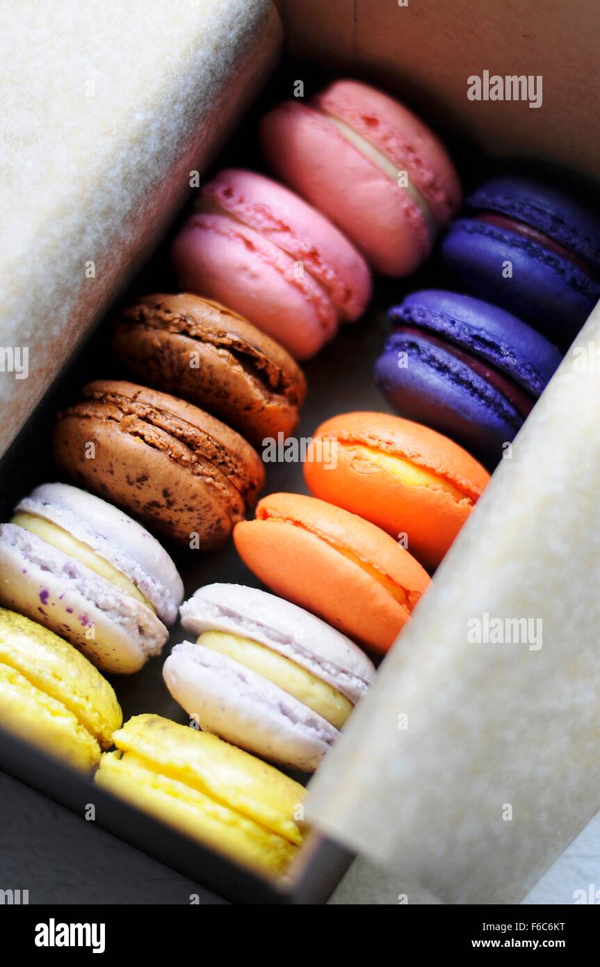 Download Assorted Colorful Macaroons In A Paper Lined Box Stock Photo Alamy PSD Mockup Templates