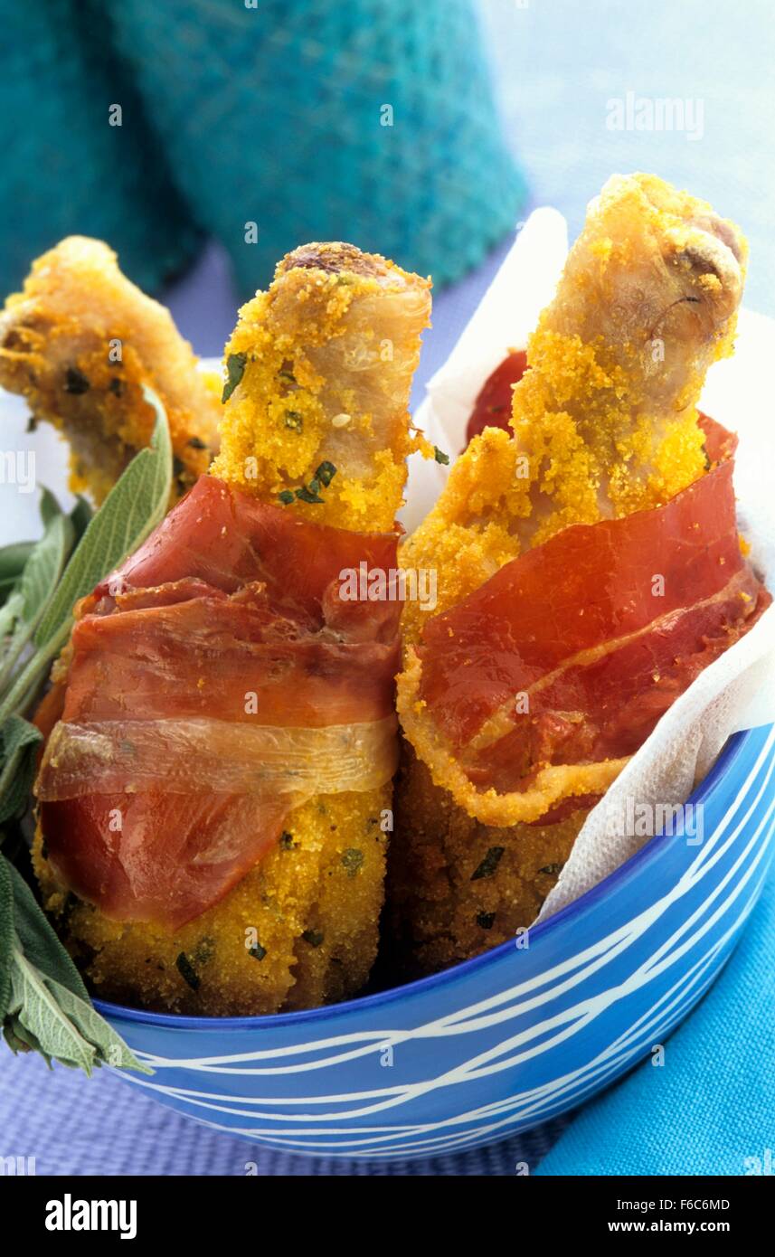 Crispy chicken drumsticks wrapped in bacon Stock Photo Alamy