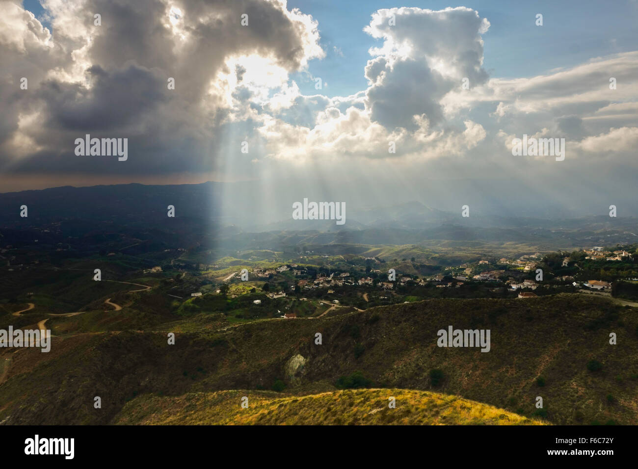 Rays of sunlight, lighten up spanish farmland in Andalusia, Spain. Stock Photo