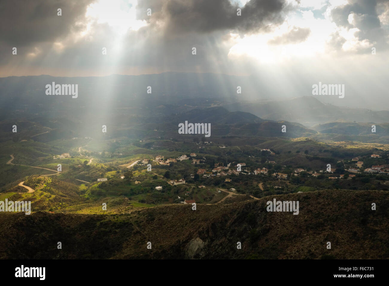 Rays of sunlight, lighten up spanish farmland in Andalusia, Spain. Stock Photo