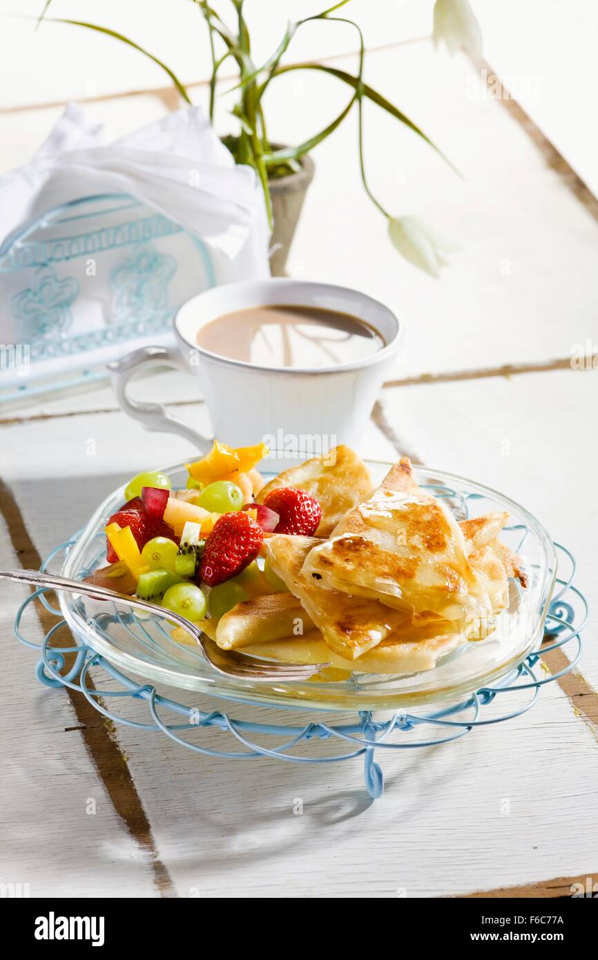 Crêpes with crème patissière and fruits Stock Photo