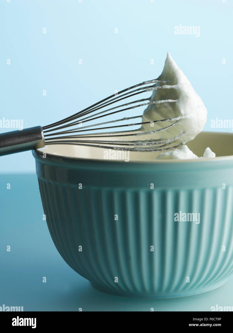 Whisked egg white on the egg whisk Stock Photo Alamy